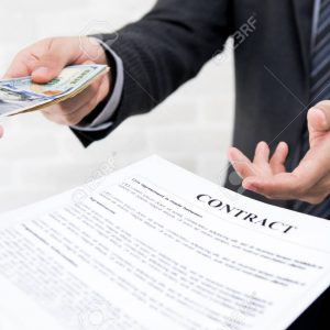 Businessman giving money together with contract Businessman giving money together with contract - debt, loan and bribery concepts